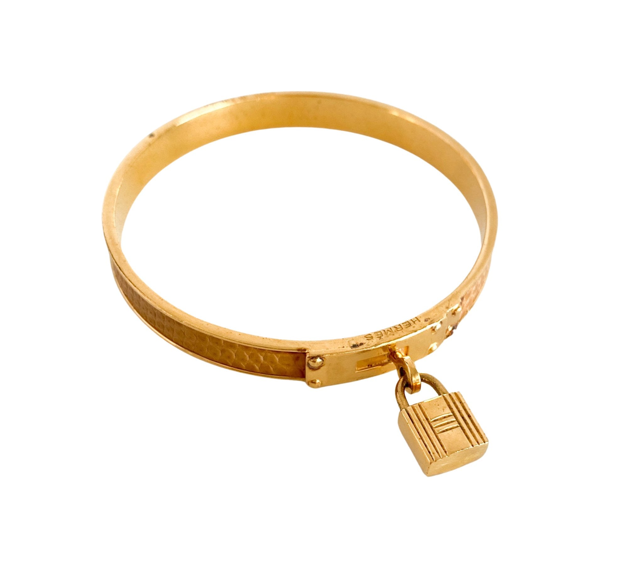 HERMÈS O'Kelly Cadena Lock Gold Plated Bangle, in , Sold by HIVE PRELOVED - Bracelets / Bangles, ,