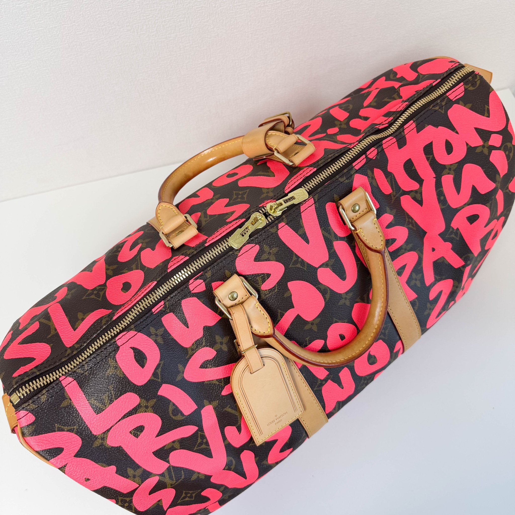LOUIS VUITTON Graffiti Keepall 50 Stephen Sprouse Pink Travel Bag, in , Sold by HIVE PRELOVED - Travel bags, ,
