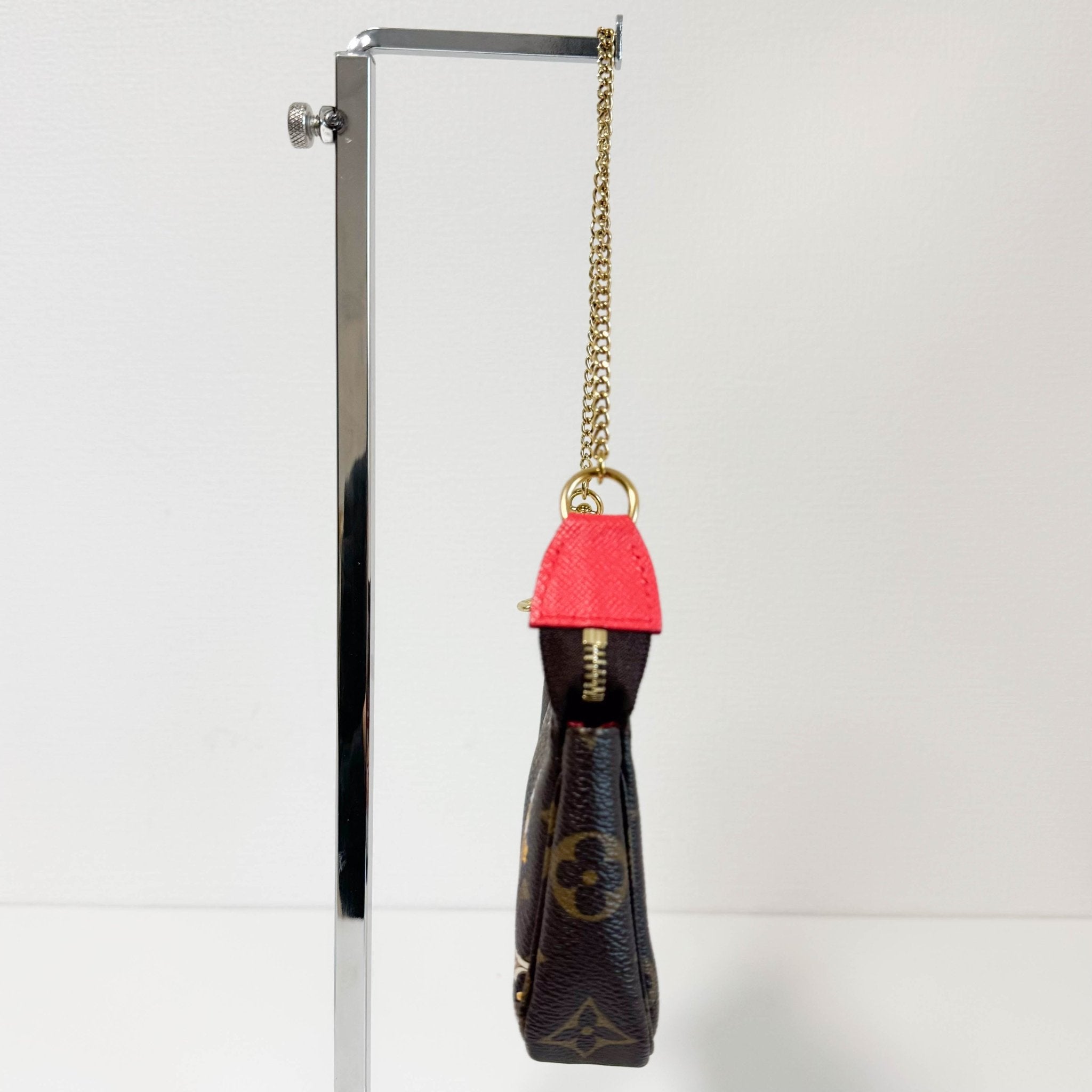 LOUIS VUITTON Monogram Mini Pochette Accessoire Rouge M80863, in , Sold by HIVE PRELOVED - Handle Bags, Shoulder Bags,