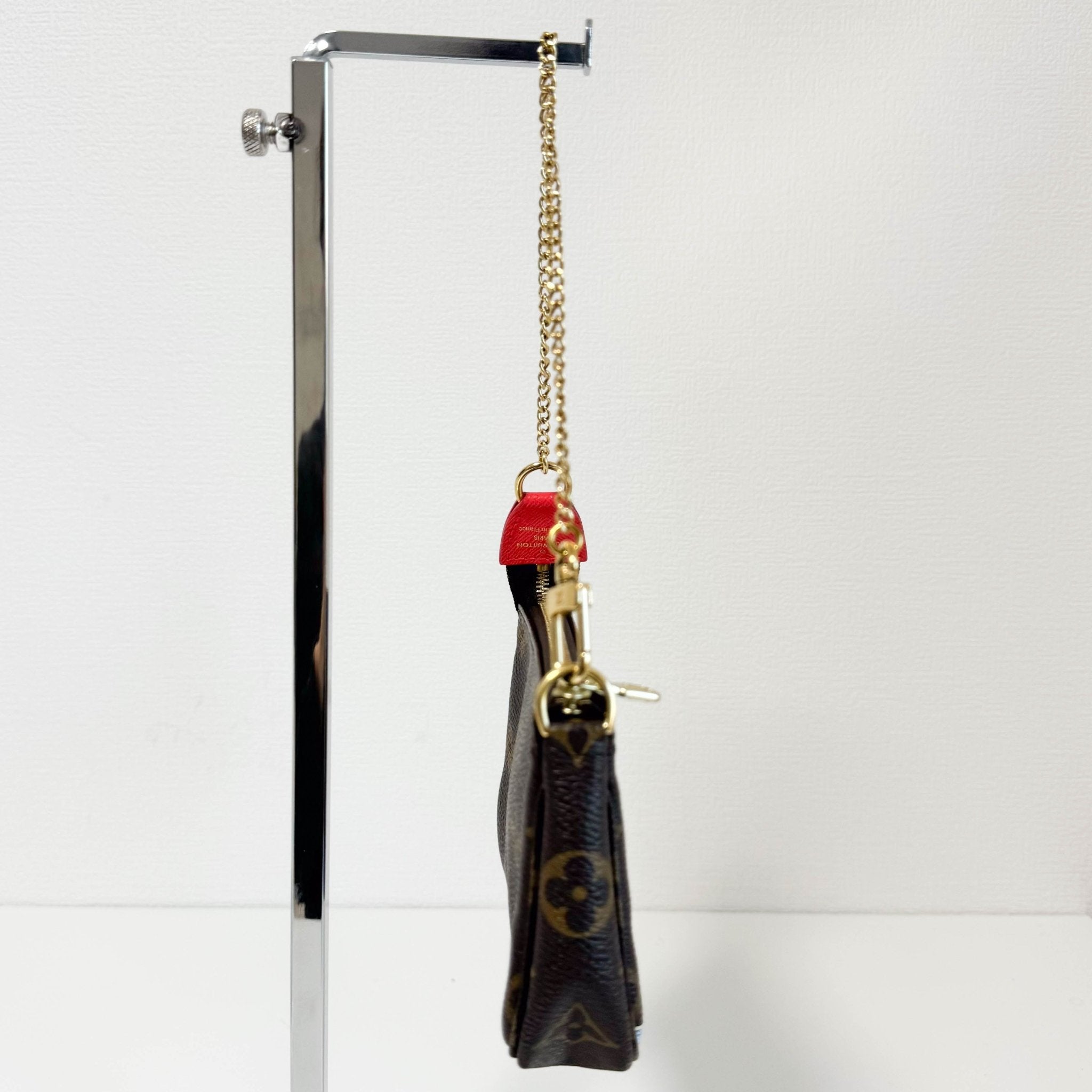 LOUIS VUITTON Monogram Mini Pochette Accessoire Rouge M80863, in , Sold by HIVE PRELOVED - Handle Bags, Shoulder Bags,