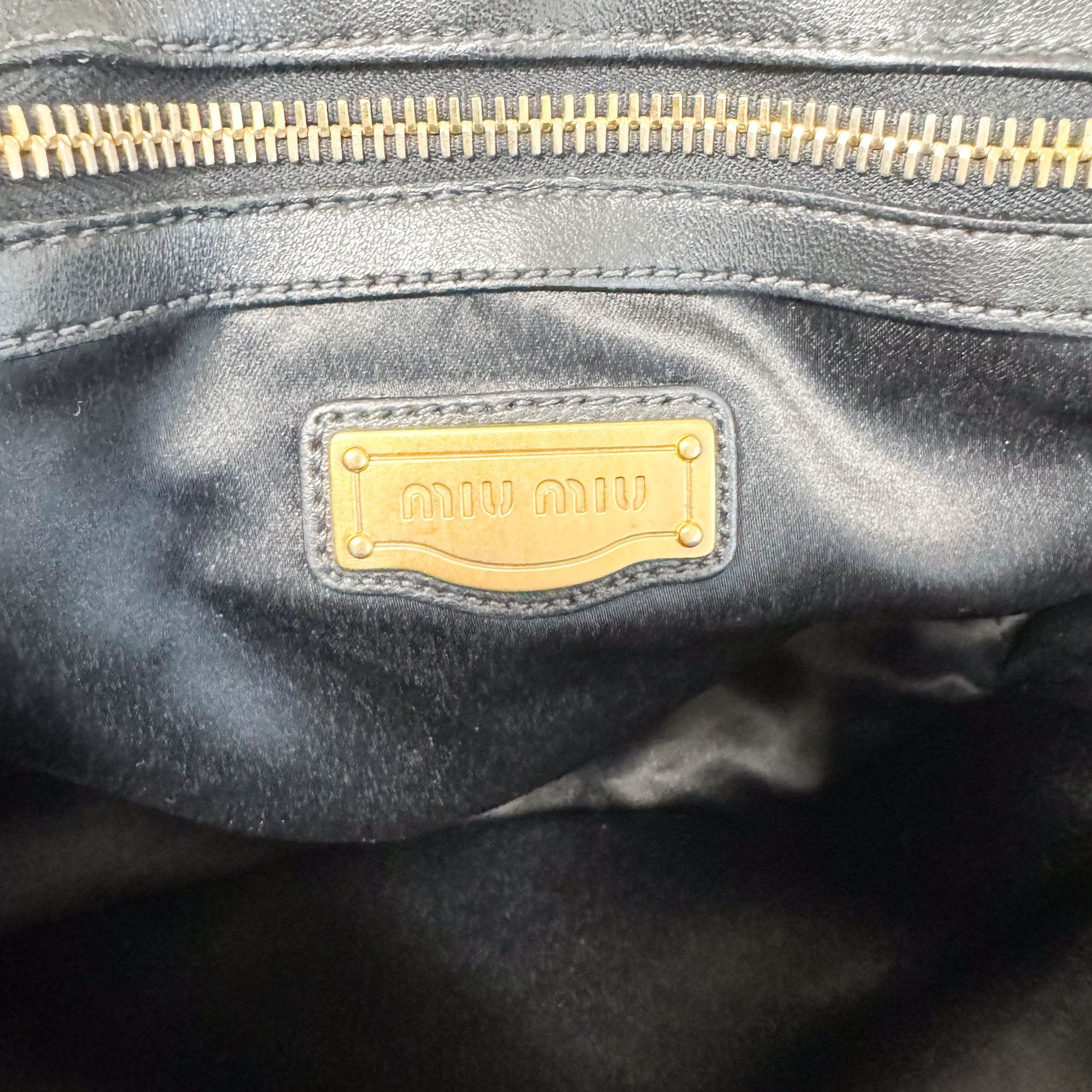 MIU MIU Matelasse Navy Leather Top Handle Bag With Crossbody Strap, in , Sold by HIVE PRELOVED - Crossbody bags, Handle Bags,