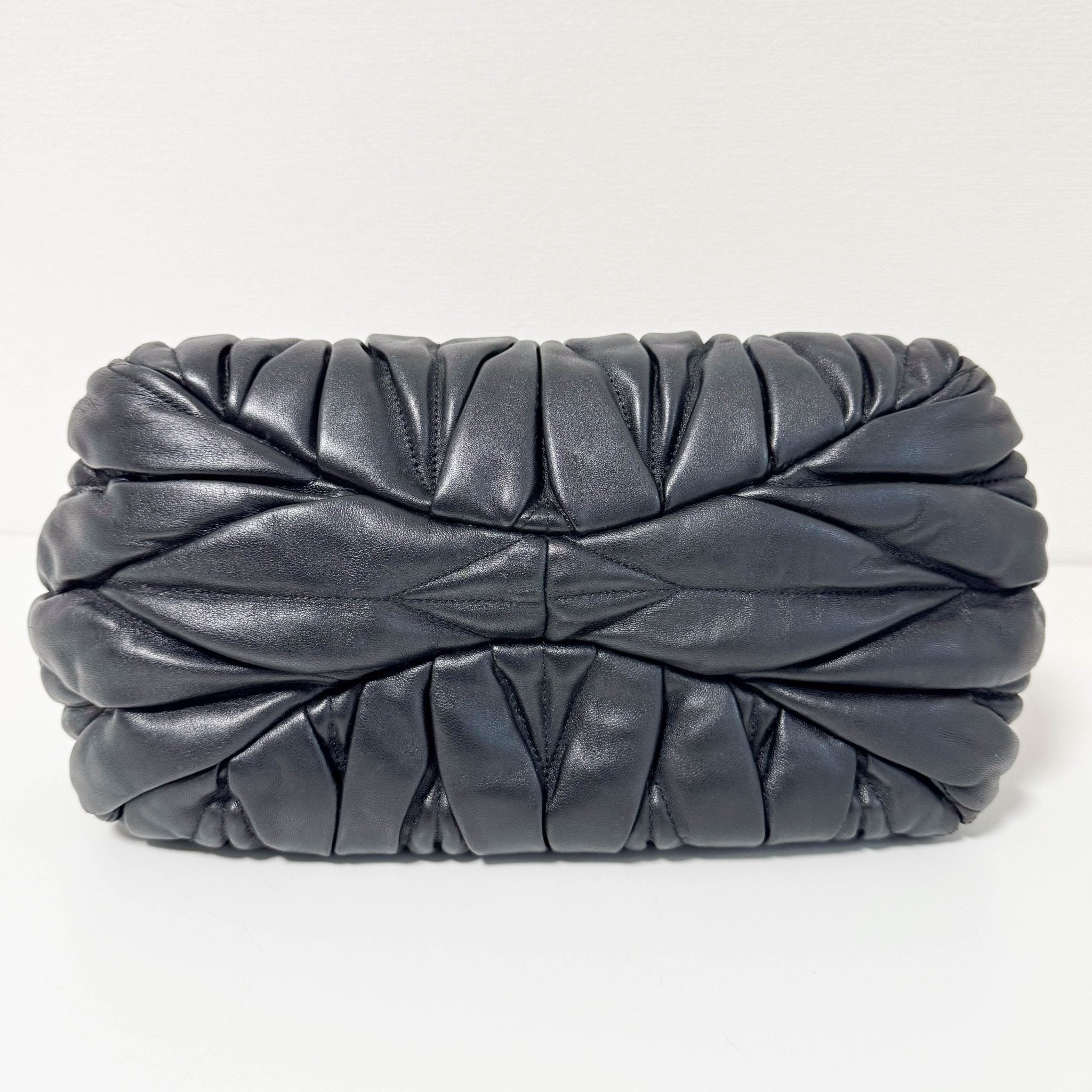 MIU MIU Matelasse Navy Leather Top Handle Bag With Crossbody Strap, in , Sold by HIVE PRELOVED - Crossbody bags, Handle Bags,