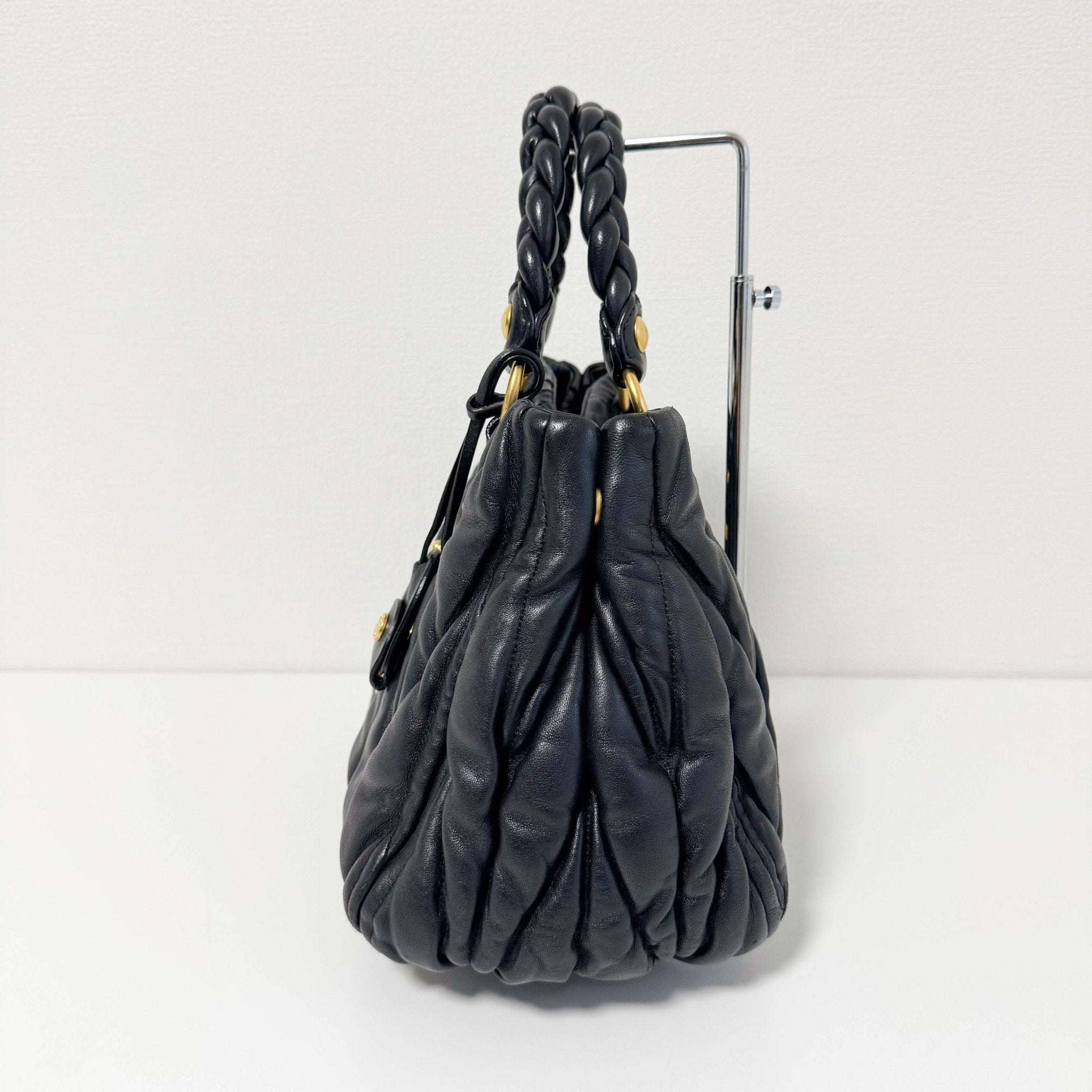 MIU MIU Matelasse Navy Leather Top Handle Bag With Crossbody Strap, in , Sold by HIVE PRELOVED - Crossbody bags, Handle Bags,