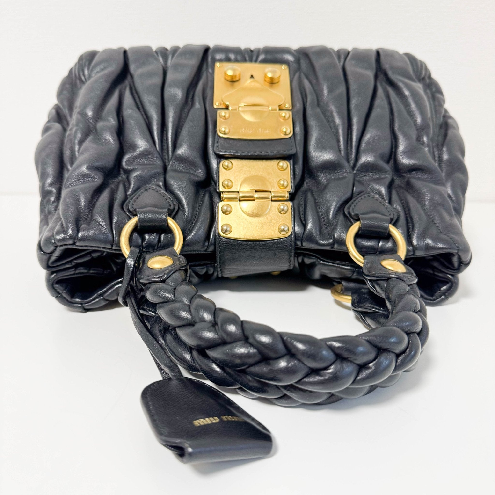 MIU MIU Matelasse Navy Leather Top Handle Bag With Crossbody Strap, in , Sold by HIVE PRELOVED - Crossbody bags, Handle Bags,