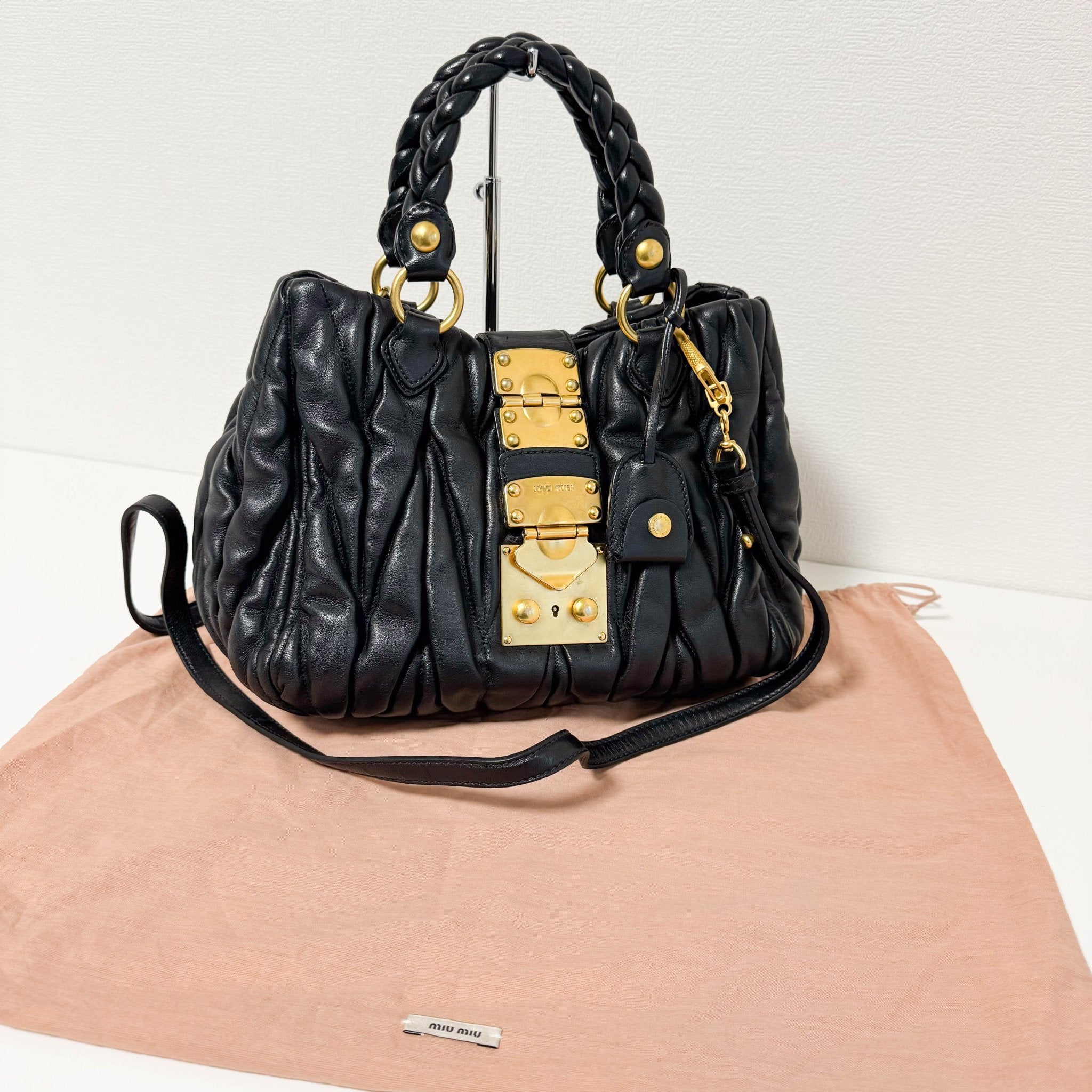 MIU MIU Matelasse Navy Leather Top Handle Bag With Crossbody Strap, in , Sold by HIVE PRELOVED - Crossbody bags, Handle Bags,