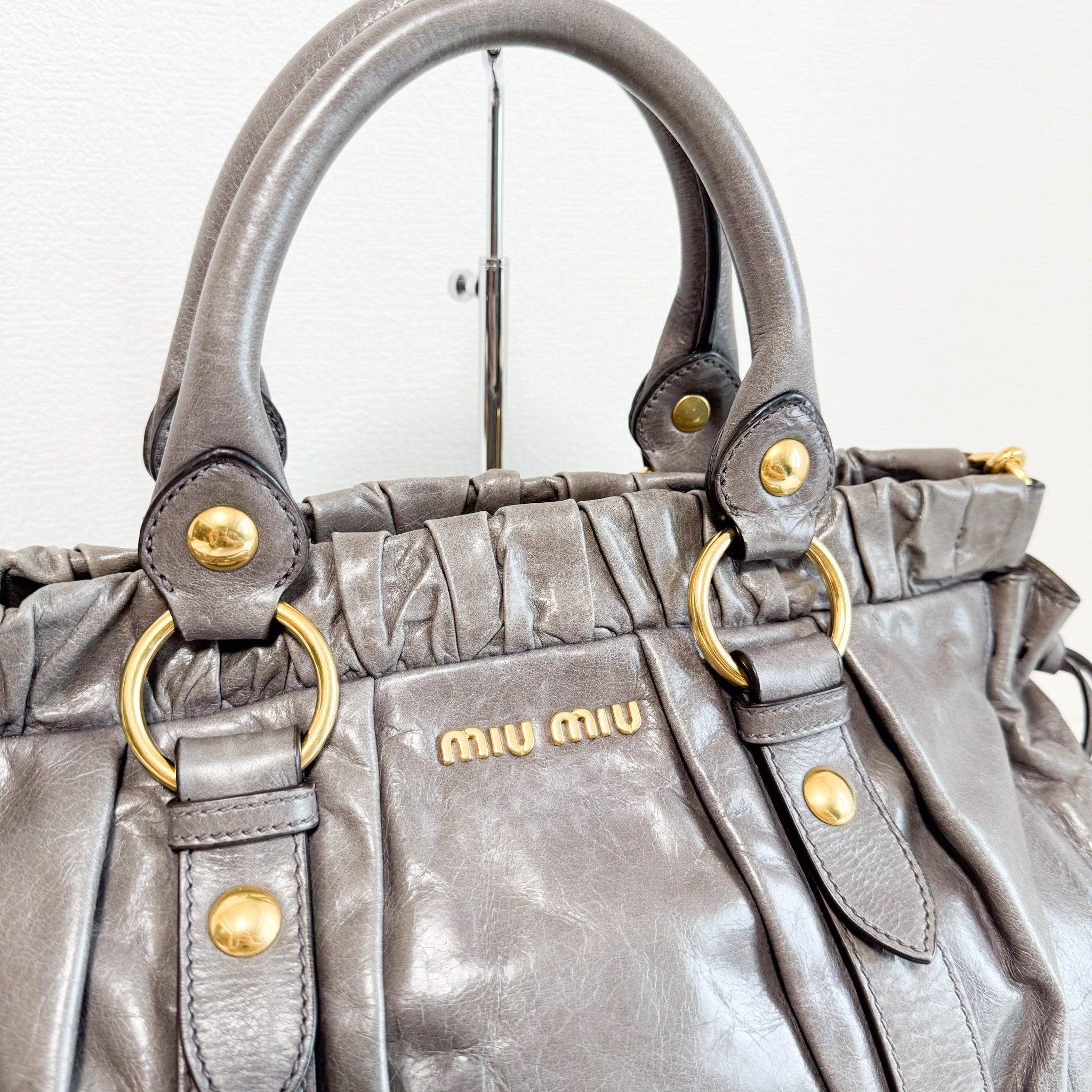 MIU MIU Vitello Bauletto Leather Handbag Grey, in , Sold by HIVE PRELOVED - Crossbody bags, Handle Bags,