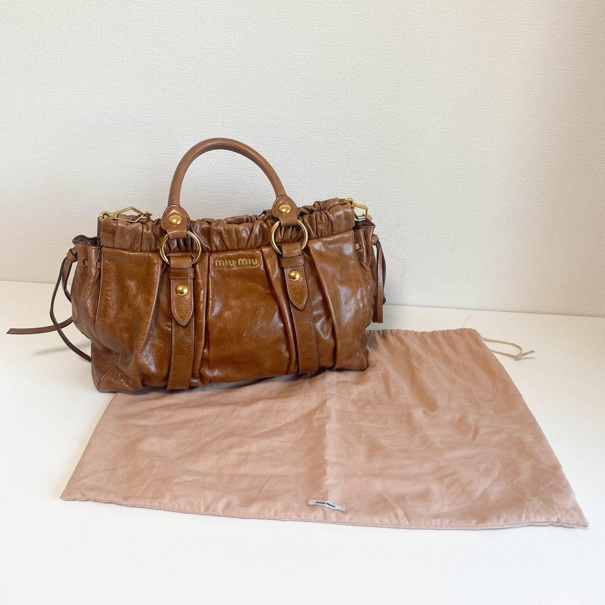 MIU MIU Vitello Luxe Brown Leather Hand Bag, in , Sold by HIVE PRELOVED - Crossbody bags, Handle Bags,