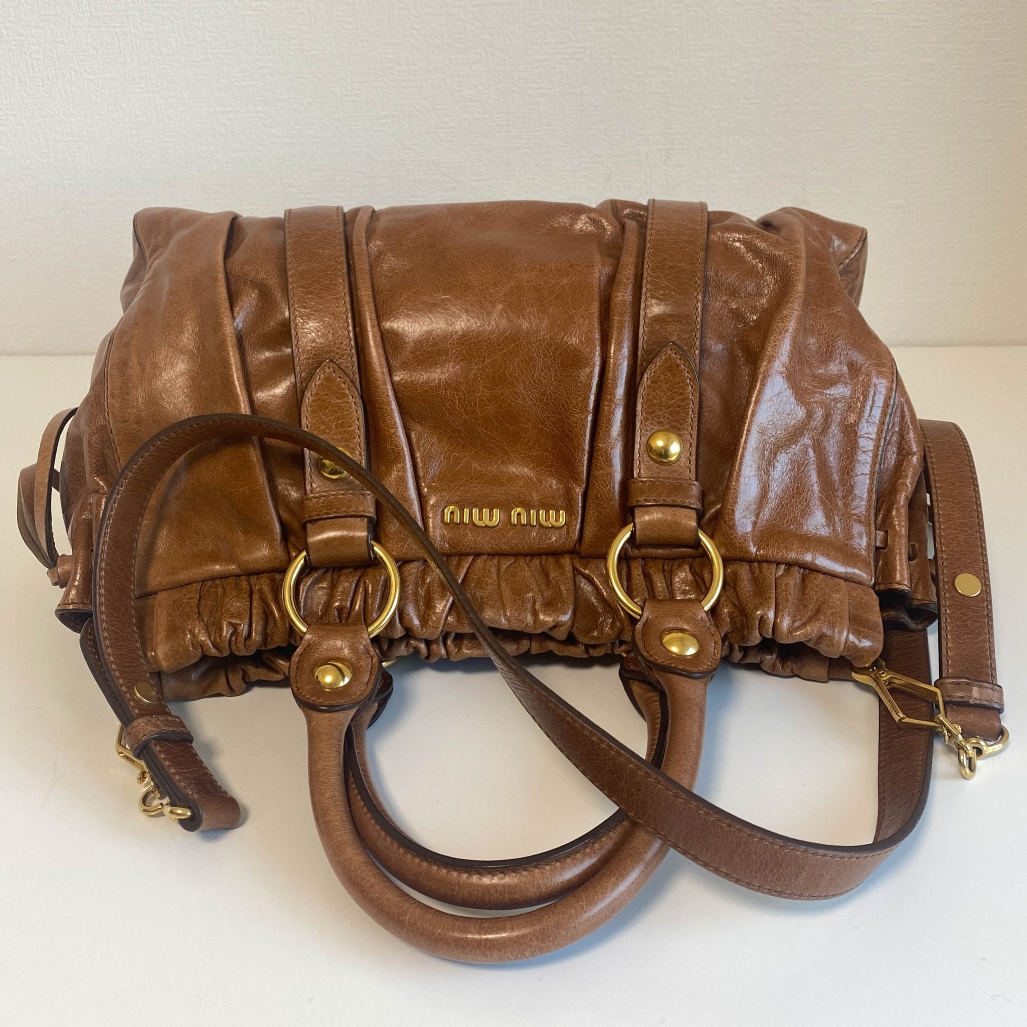 MIU MIU Vitello Luxe Brown Leather Hand Bag, in , Sold by HIVE PRELOVED - Crossbody bags, Handle Bags,