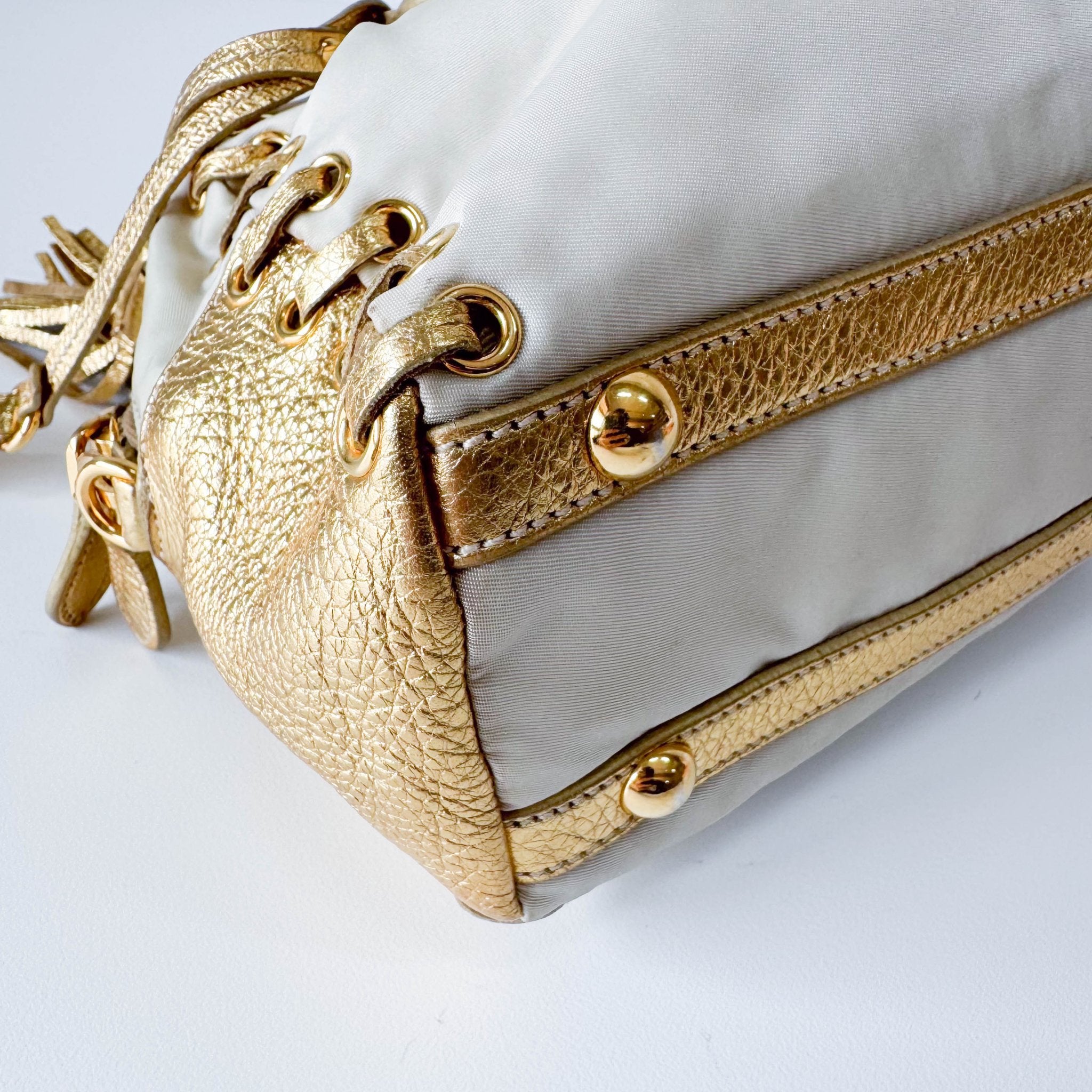 PRADA Bow Gold Leather and Nylon Hand Bag, in , Sold by HIVE PRELOVED - Handle Bags, ,