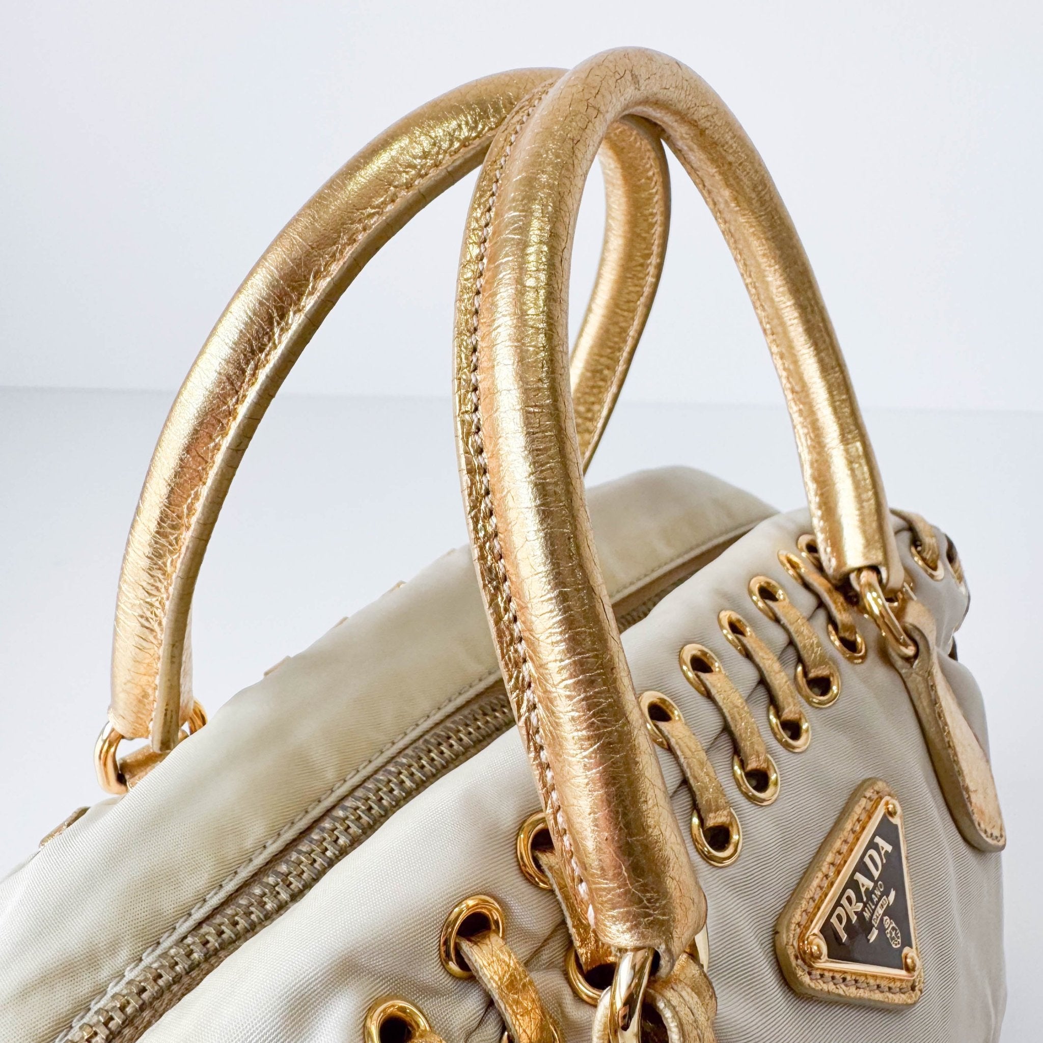 PRADA Bow Gold Leather and Nylon Hand Bag, in , Sold by HIVE PRELOVED - Handle Bags, ,