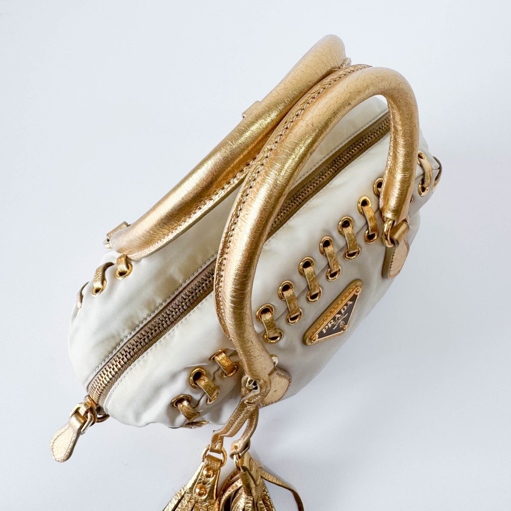 PRADA Bow Gold Leather and Nylon Hand Bag, in , Sold by HIVE PRELOVED - Handle Bags, ,