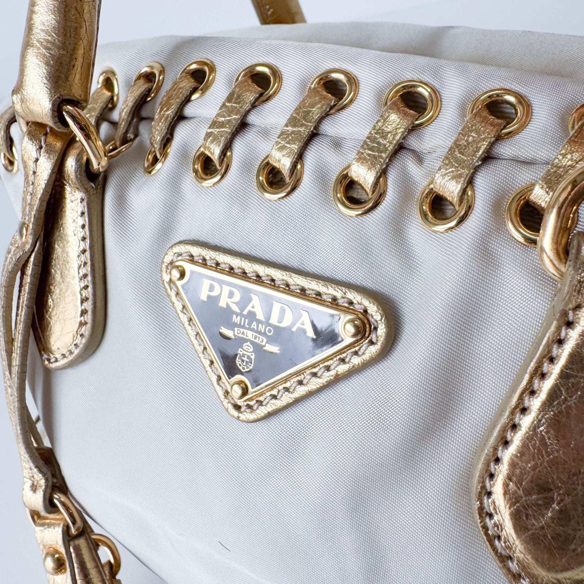 PRADA Bow Gold Leather and Nylon Hand Bag, in , Sold by HIVE PRELOVED - Handle Bags, ,