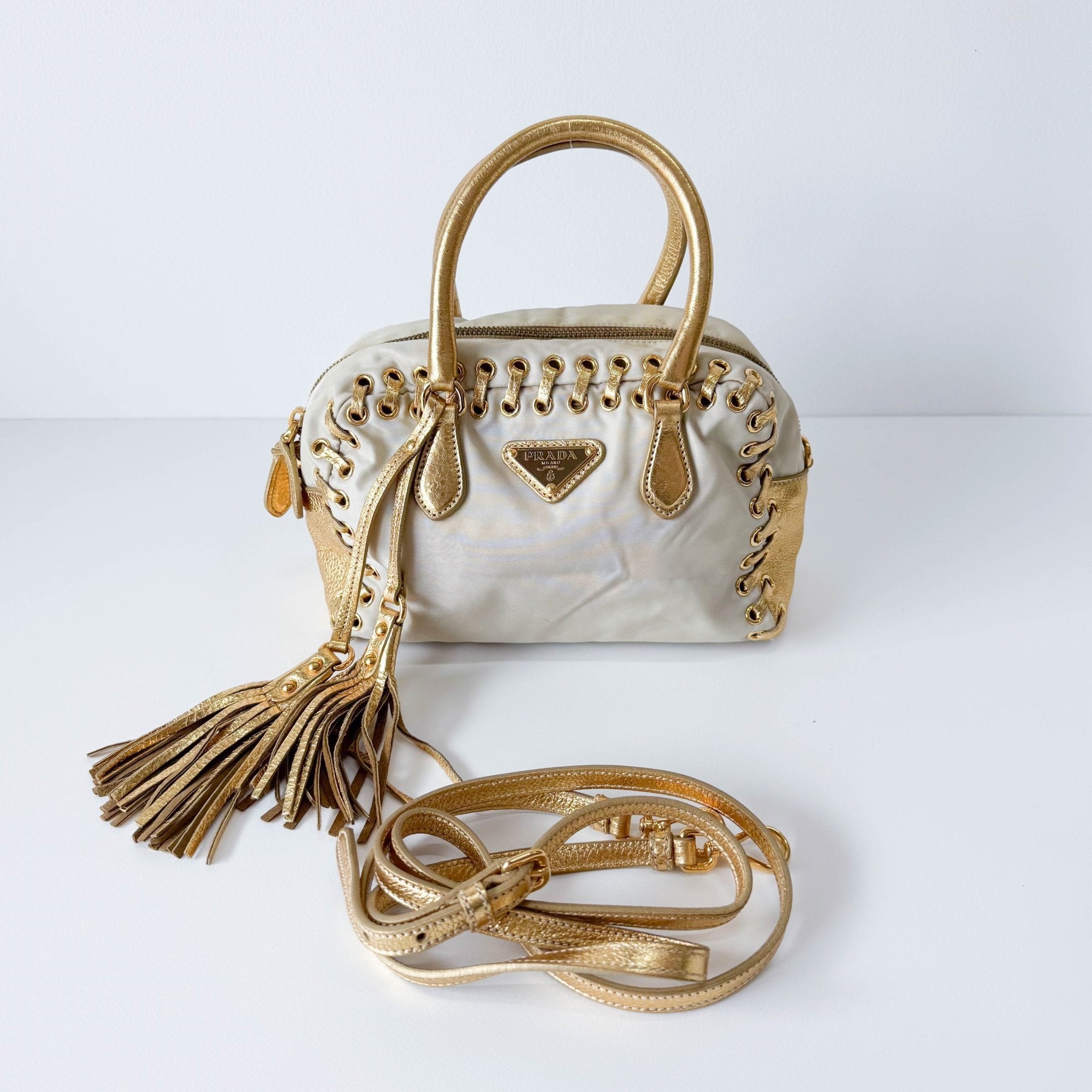 PRADA Bow Gold Leather and Nylon Hand Bag, in , Sold by HIVE PRELOVED - Handle Bags, ,