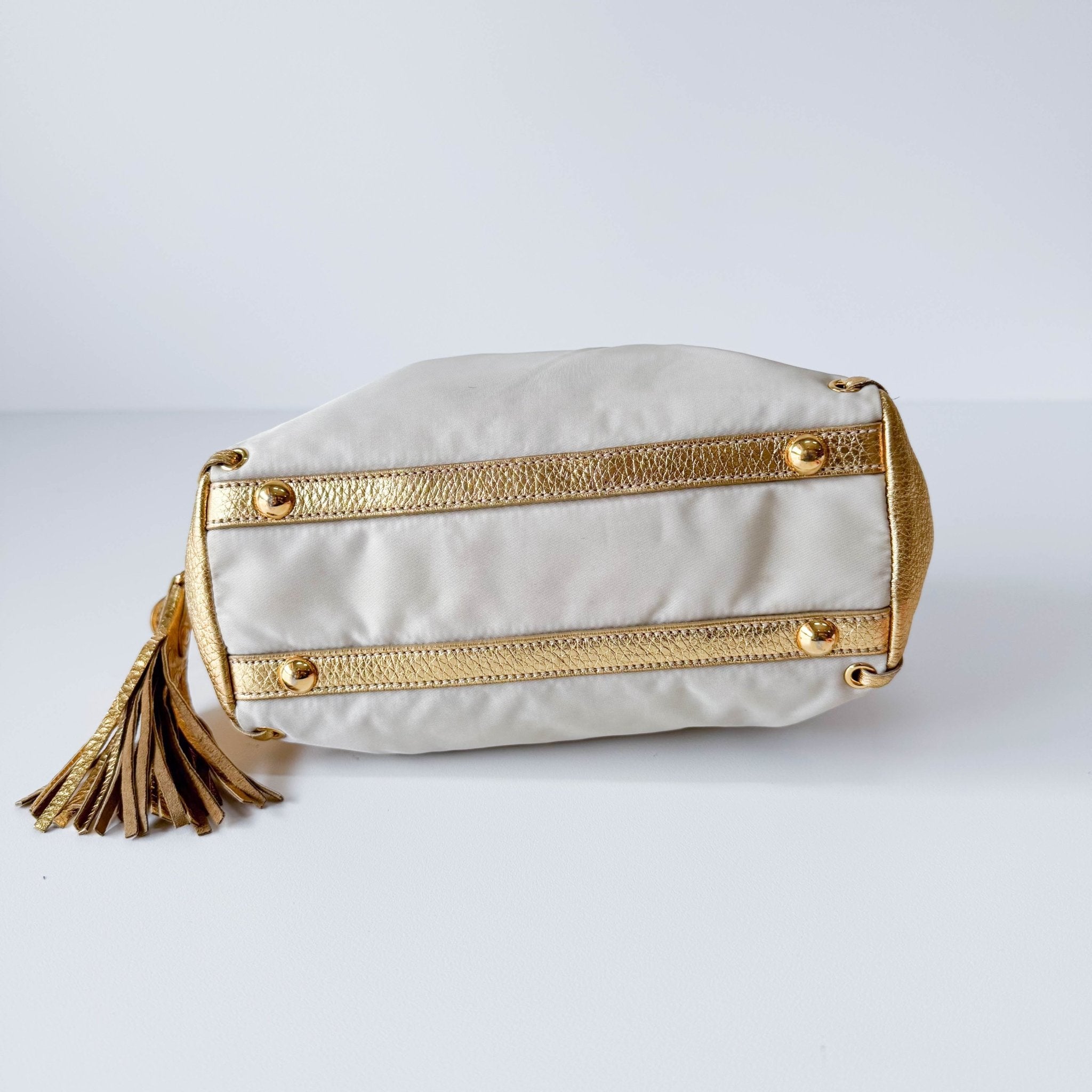 PRADA Bow Gold Leather and Nylon Hand Bag, in , Sold by HIVE PRELOVED - Handle Bags, ,