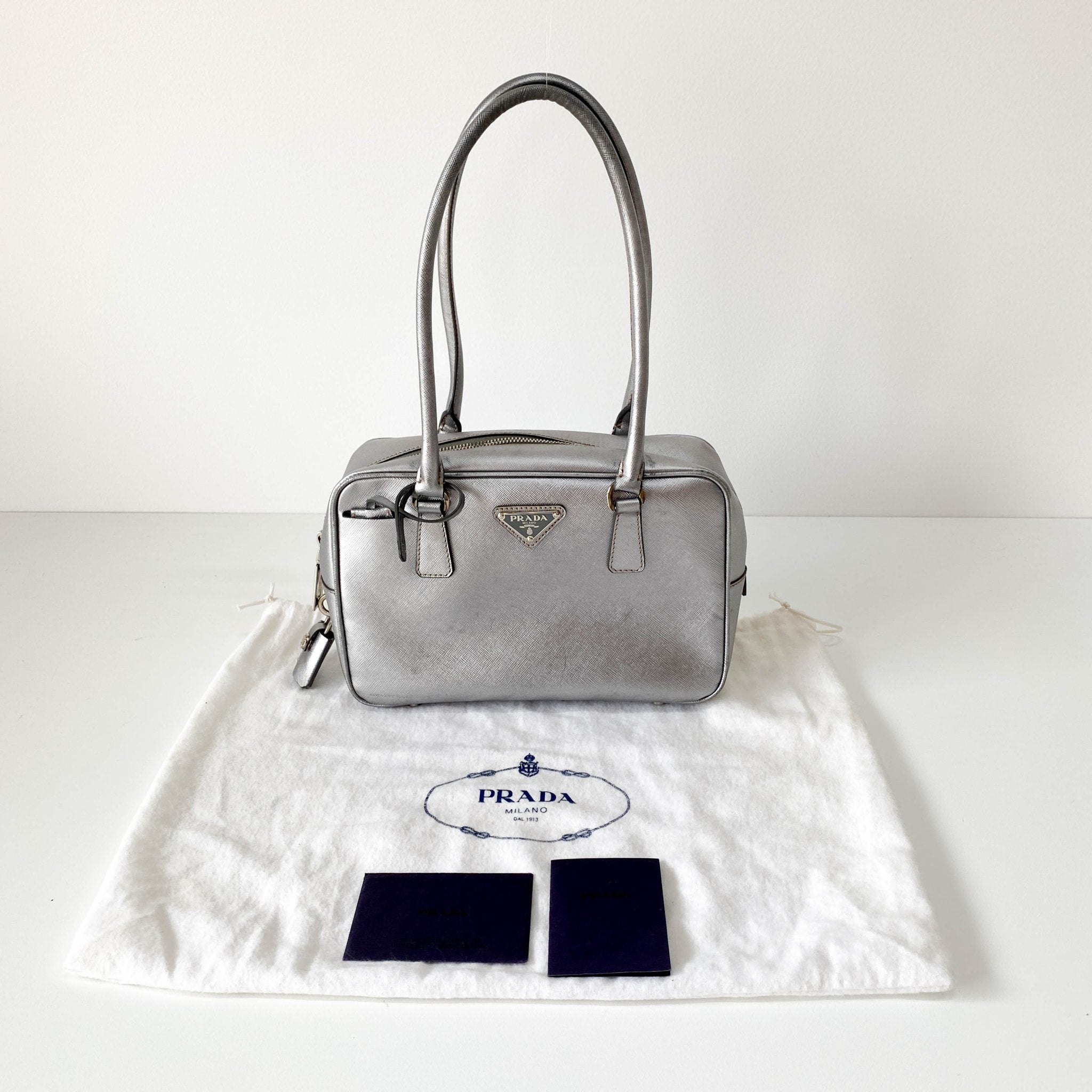 PRADA Silver Clochard Key & Lock Shoulder Bag, in , Sold by HIVE PRELOVED - Shoulder Bags, ,
